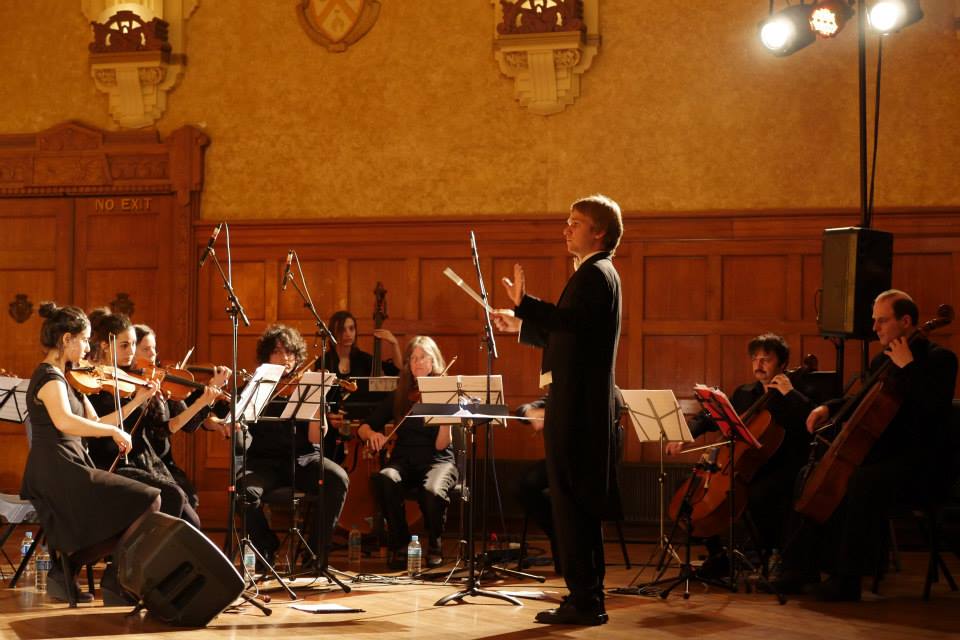 Orchestra and conductor